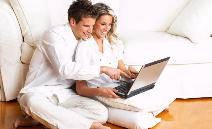 couples research their retreat plans on the internet